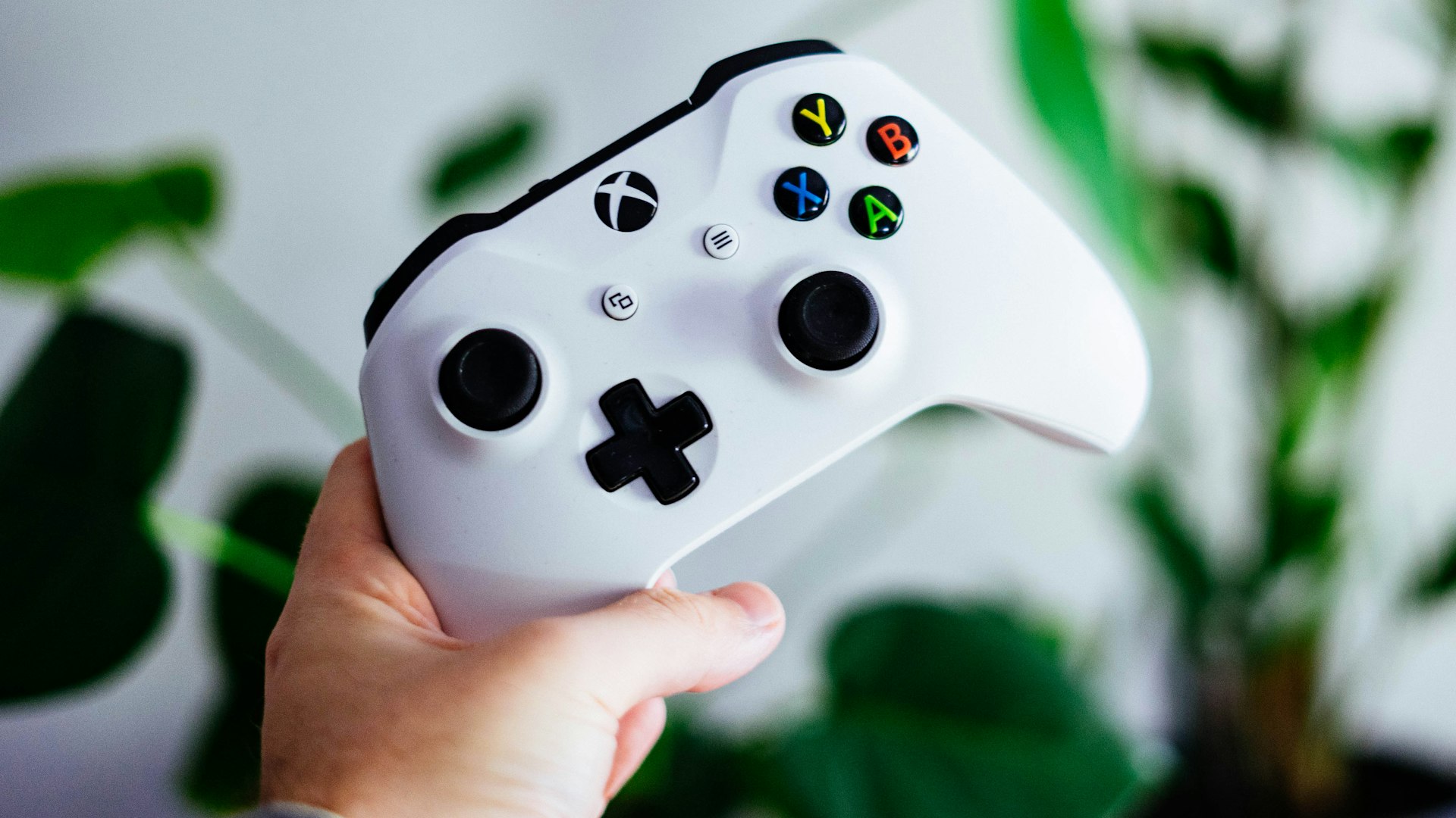 Gaming setup with controller and glowing screen